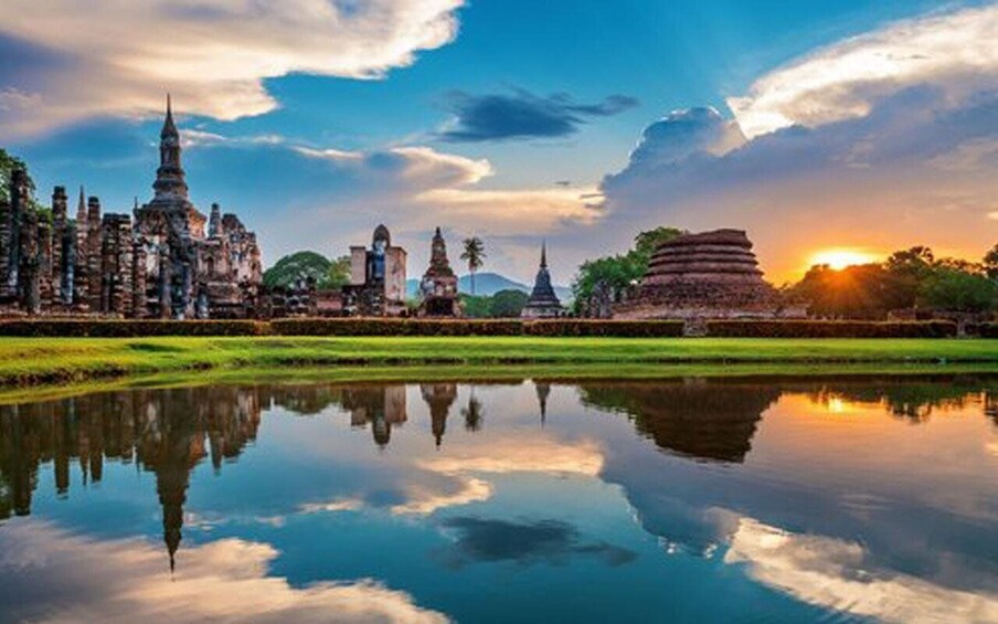 Ancient ruins with a reflection in the water, a clear sky, and a sunset. 2