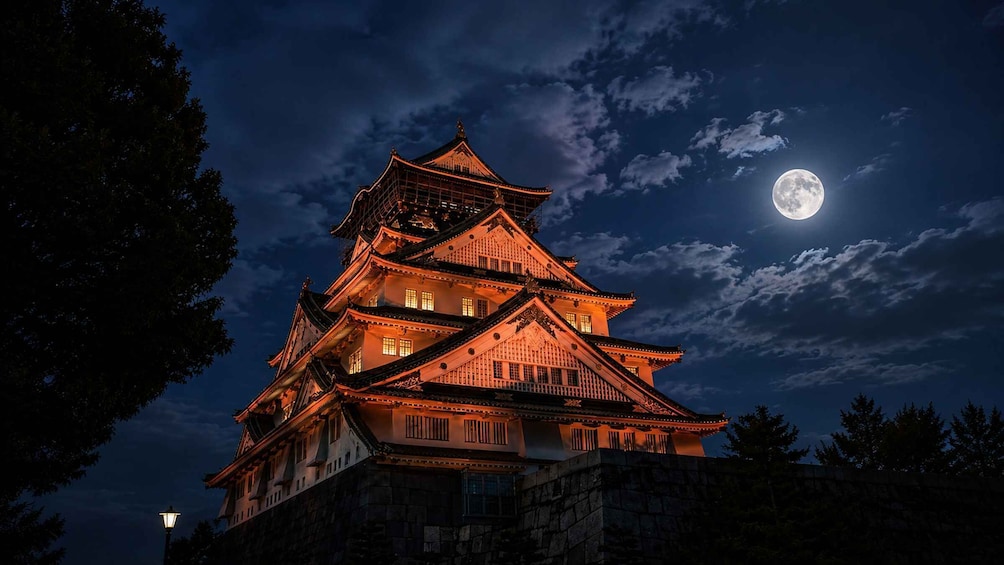 A traditional Japanese castle at night with a full moon in the sky. 1