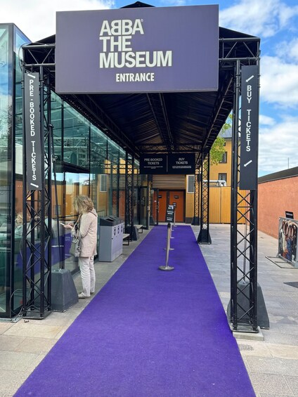 The entrance to ABBA The Museum with signs for pre-booked and buy tickets. 3