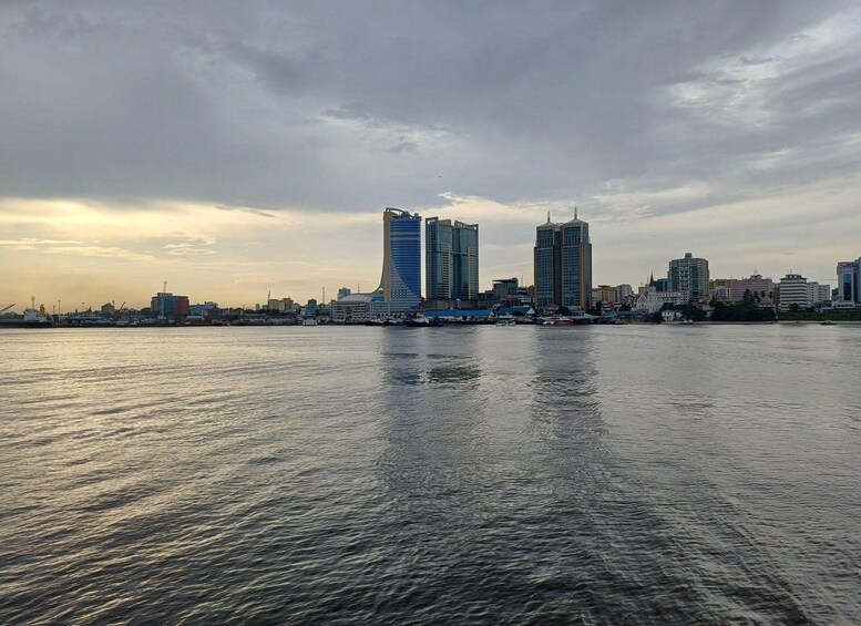 A waterfront cityscape with modern buildings and a calm river. 4