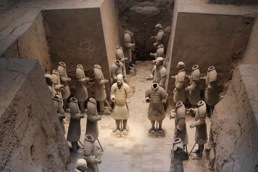 Terracotta soldiers arranged in a formation, likely representing a historical military scene. 4
