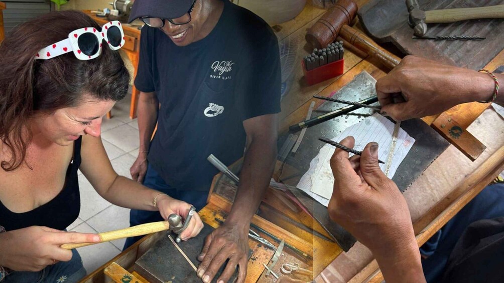 A person hammering a nail into a wooden surface. 1