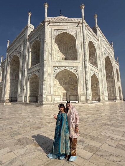 The Taj Mahal with intricate marble carvings and a large central archway. 3