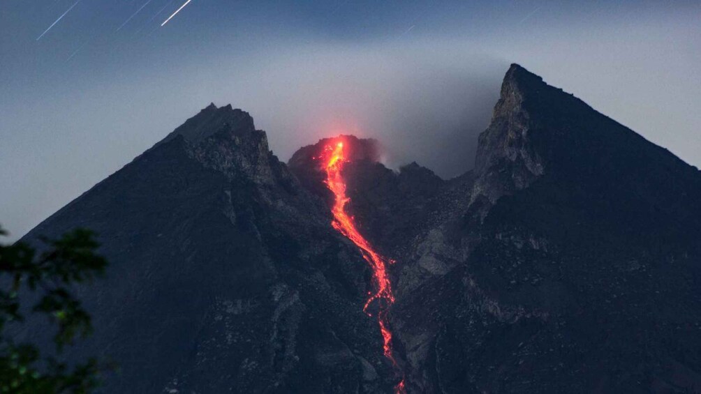A mountain with a flowing lava stream. 1