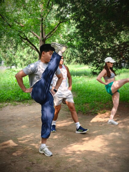 People exercising outdoors in a park. 4