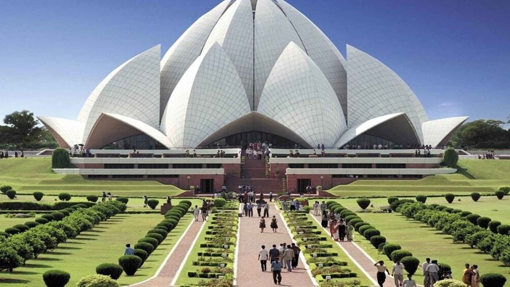 A large lotus-shaped building with a central dome and multiple tiers of terraces. 1
