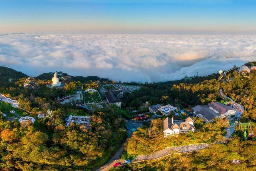 A mountainous landscape with a temple, gardens, and a village below the clouds. 2