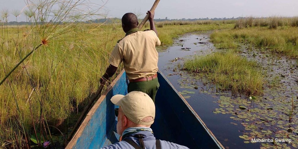 Two people in a canoe on a swamp with water lilies. 5