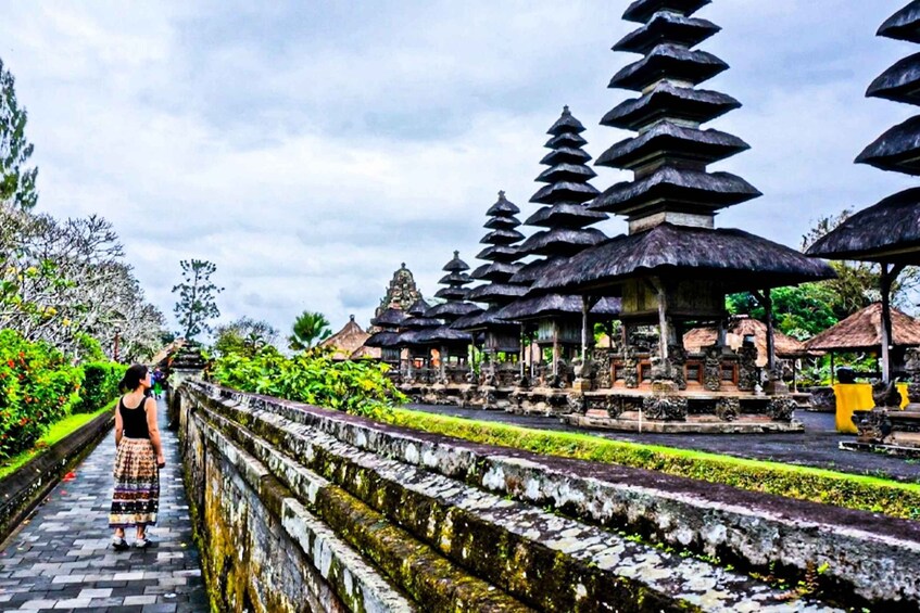 A temple complex with tiered roofs and stone pathways. 3