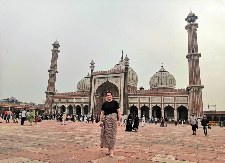 A large mosque with two tall minarets and a central dome. 1
