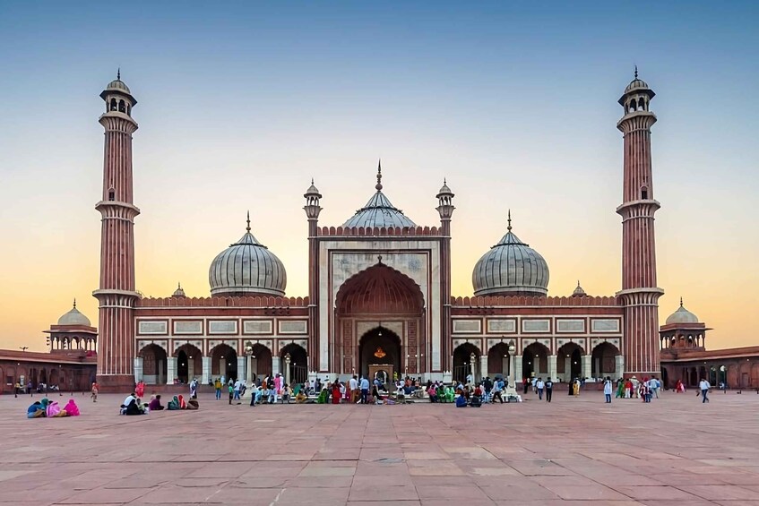 A large mosque with multiple domes and minarets. 2
