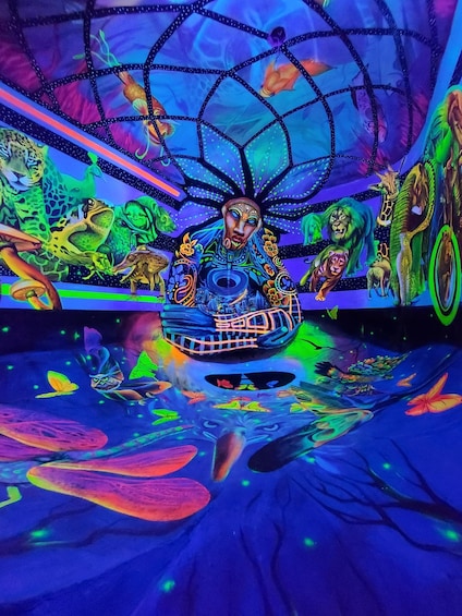 A vibrant, colorful mural with a central figure surrounded by various animals and mythical creatures. 2