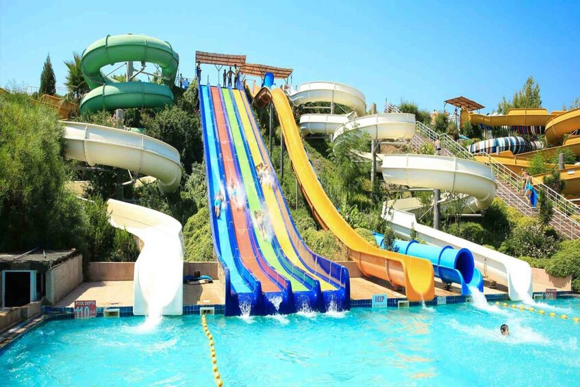 A water park with multiple slides and water features. 1