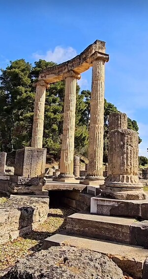 Ancient ruins with columns and stone structures. 5