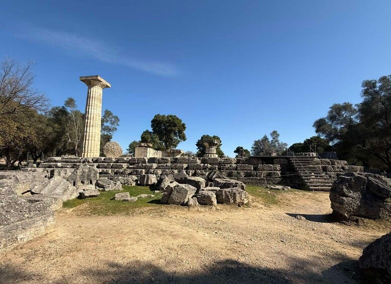 Ancient ruins with stone columns and scattered stones. 3