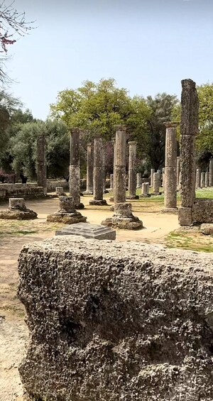Ancient stone columns in a historical site. 2