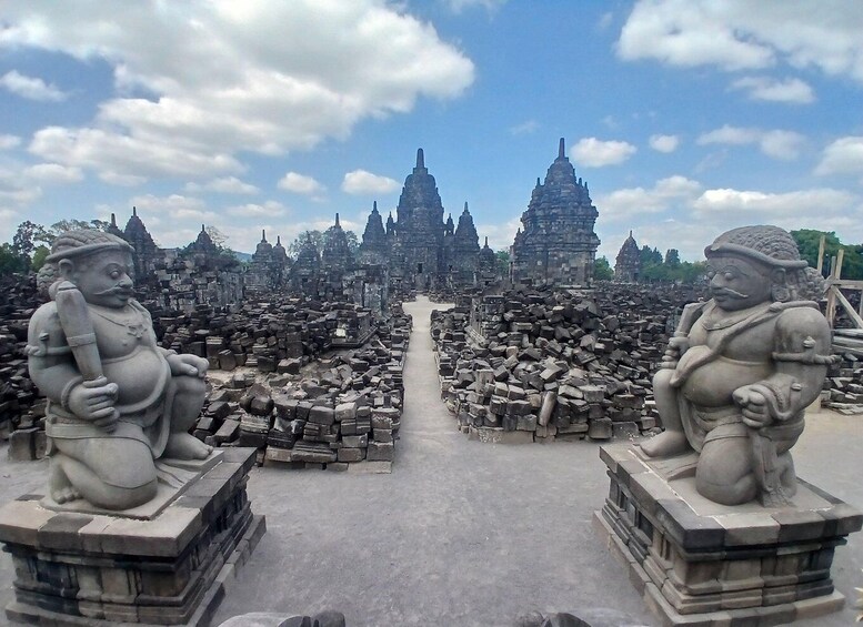A temple complex with stone statues and ruins. 4