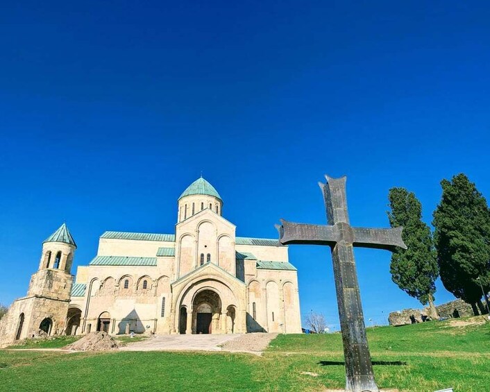 A church with a large dome and a cross in the foreground. 4