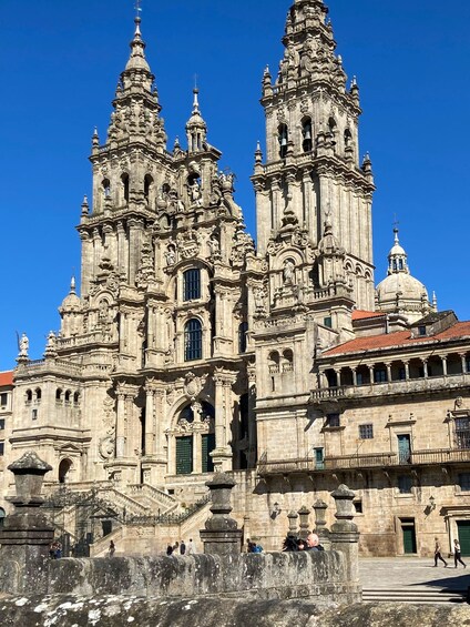 A historic cathedral with intricate architecture and a clear blue sky. 2