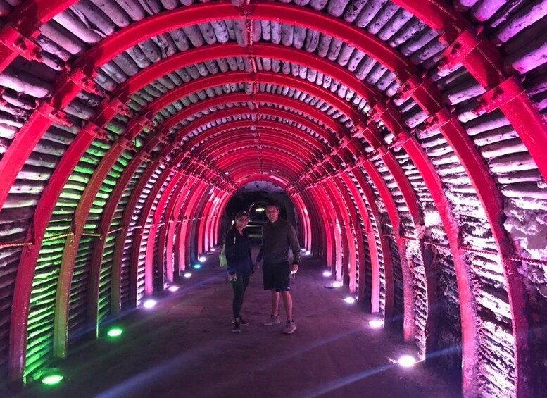 A tunnel with red and green lighting. 1