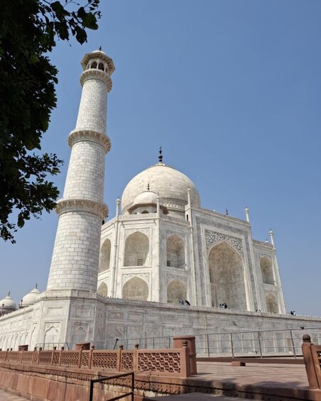 The Taj Mahal with its iconic white marble dome and minaret. 5