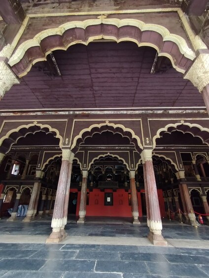 An ornate architectural interior with arches and columns. 1