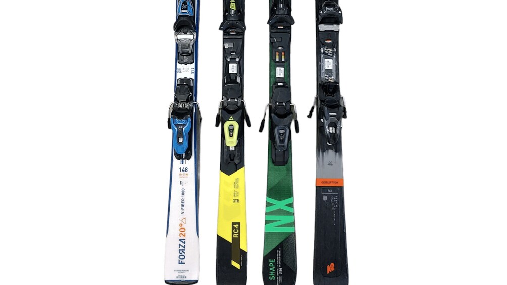 Four skis with different designs and colors. 2