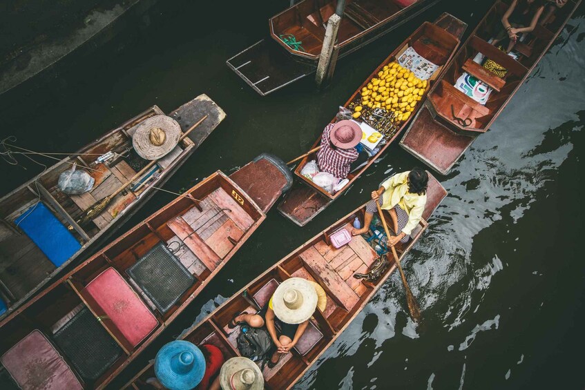 A group of wooden boats docked at a pier. 1