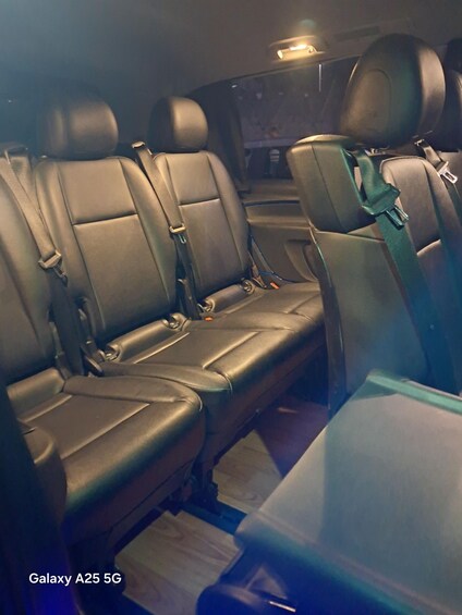 The interior of a Galaxy A25 5G car with leather seats and seatbelts. 5