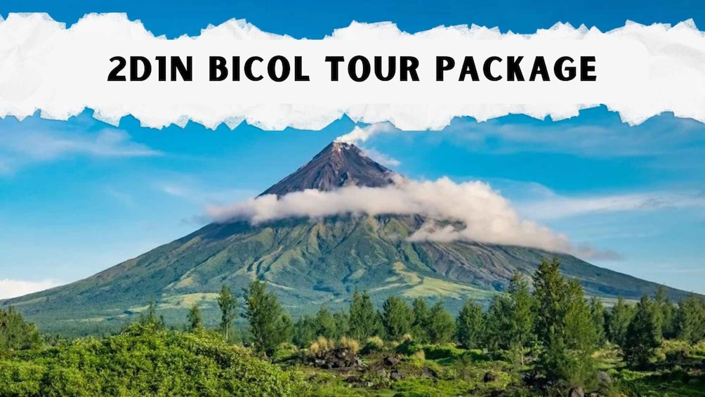 A volcano with a cloud of smoke at its peak, surrounded by greenery and a clear blue sky. 1