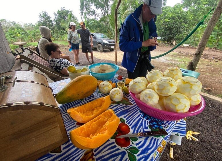 A table with various fruits and a large drum. 5