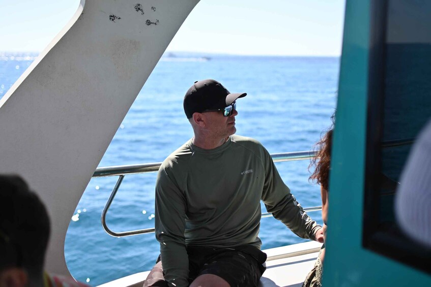 A person on a boat with the ocean in the background. 4