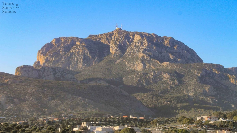 A mountain with a small town at its base. 3