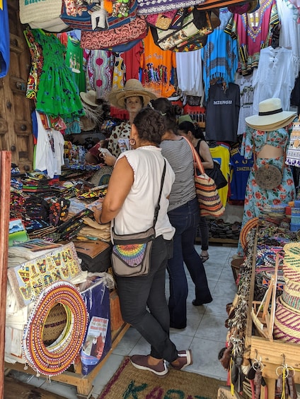A market stall with colorful textiles and jewelry. 4