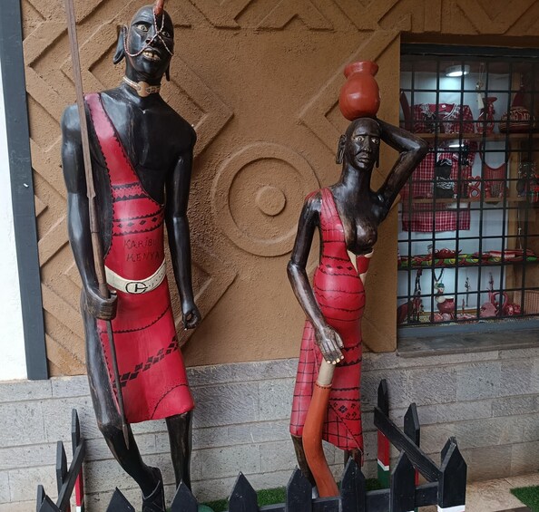 A sculpture of a man and woman in traditional attire. 5