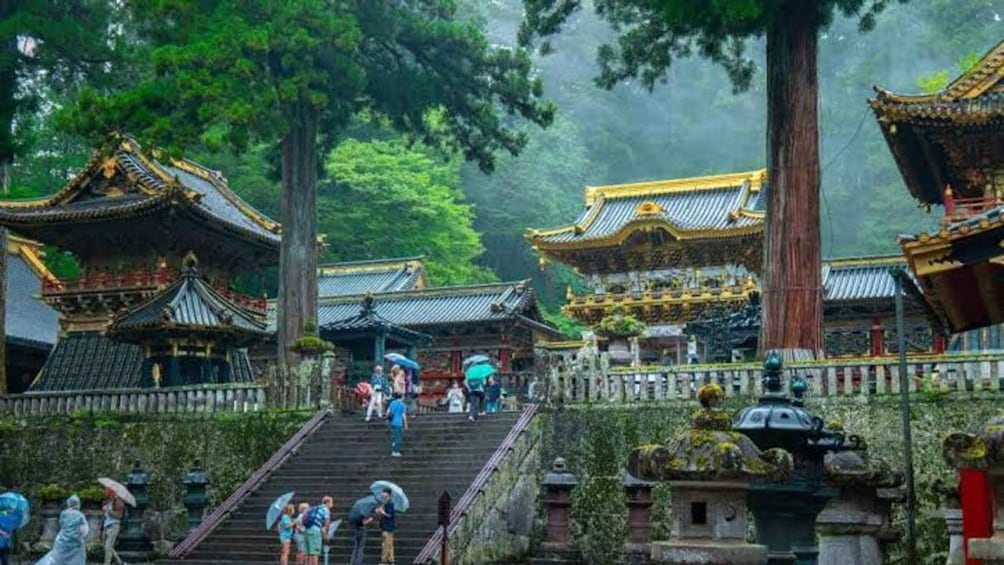 A traditional Chinese temple complex with ornate architecture, including tiered roofs and intricate carvings. 1