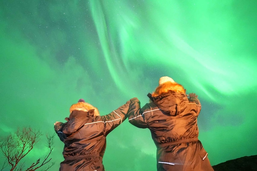 Two people observing the Northern Lights. 2