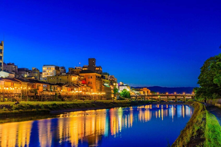 A river reflecting city lights at dusk. 5
