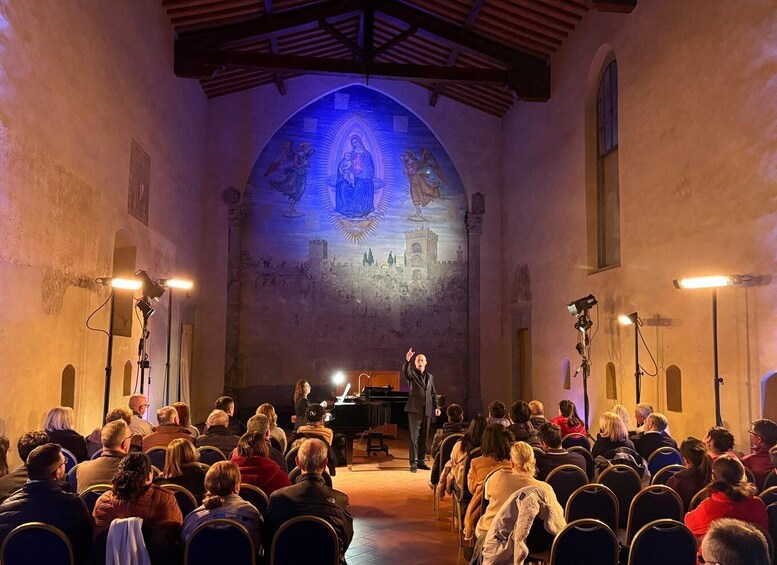 A church interior with a congregation seated and a pianist performing. 1