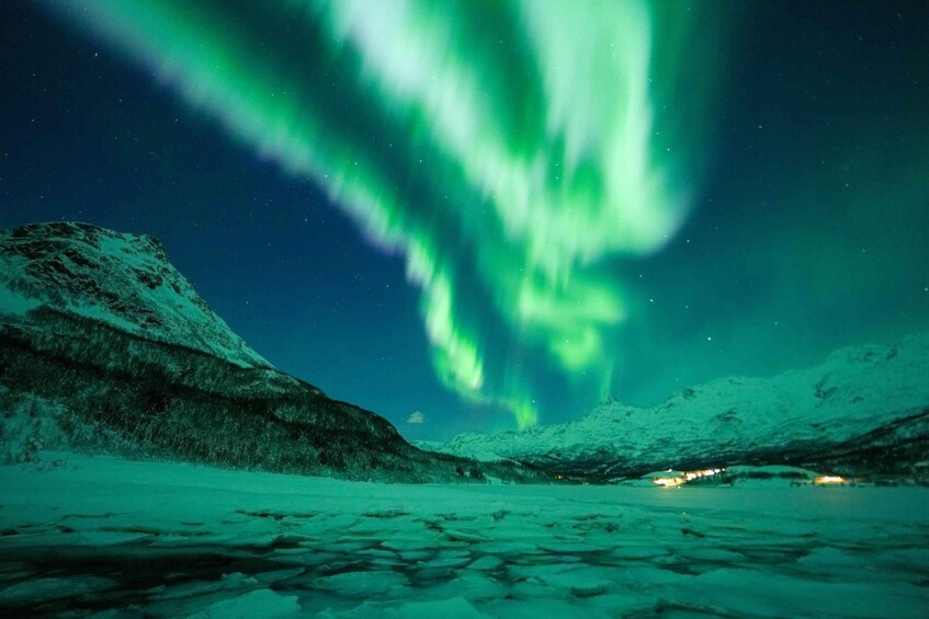 A snowy landscape with aurora borealis. 4