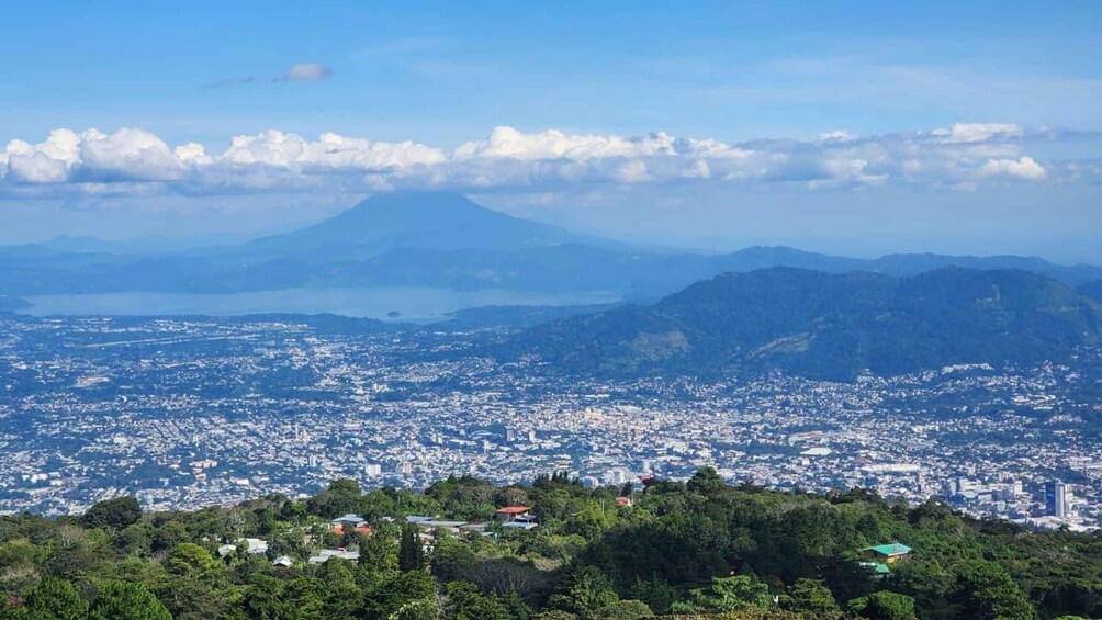 A cityscape with a mountain in the background. 2