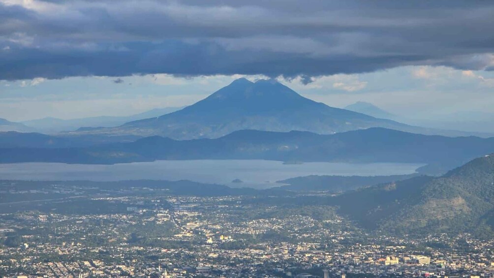 A cityscape with a prominent mountain in the background. 5
