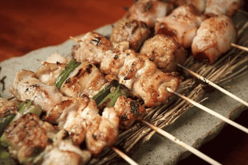 Skewered chicken and vegetables on a grill. 4