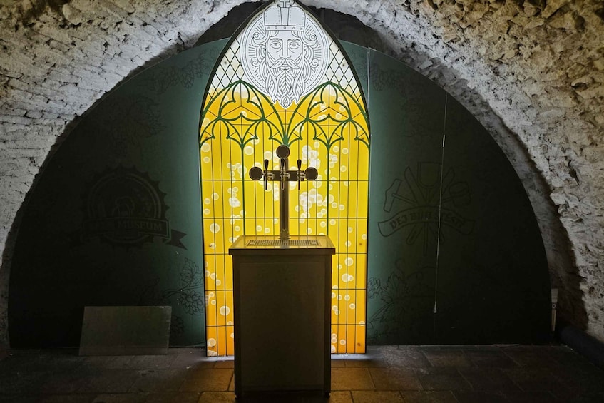 A stained glass window with a central figure, a wooden lectern, and a wall with graffiti. 3