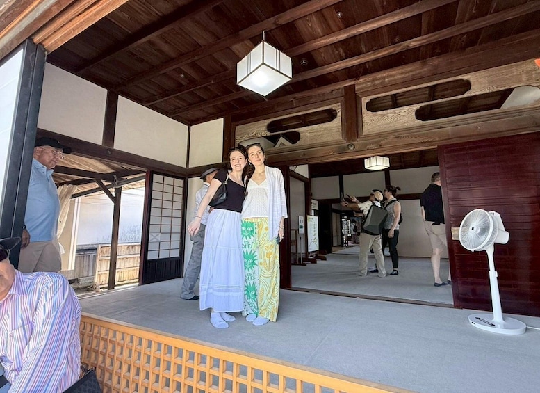 A traditional Japanese building with wooden beams and tatami flooring. 4