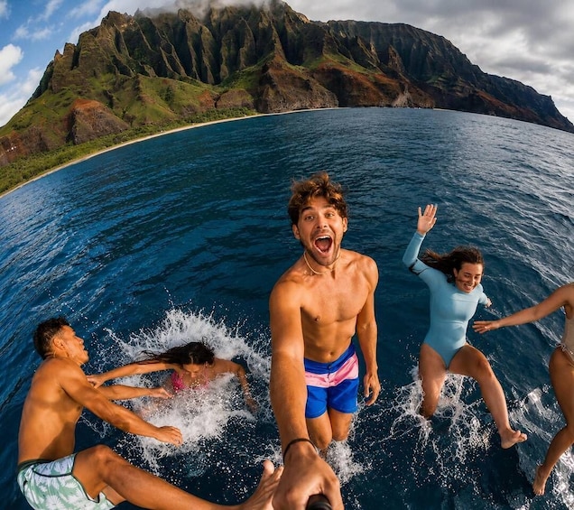 A group of people swimming in a body of water with a mountainous landscape in the background. 3