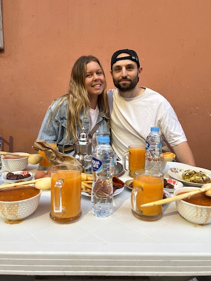 A table with food and drinks, including a bottle of Aquafina water. 5
