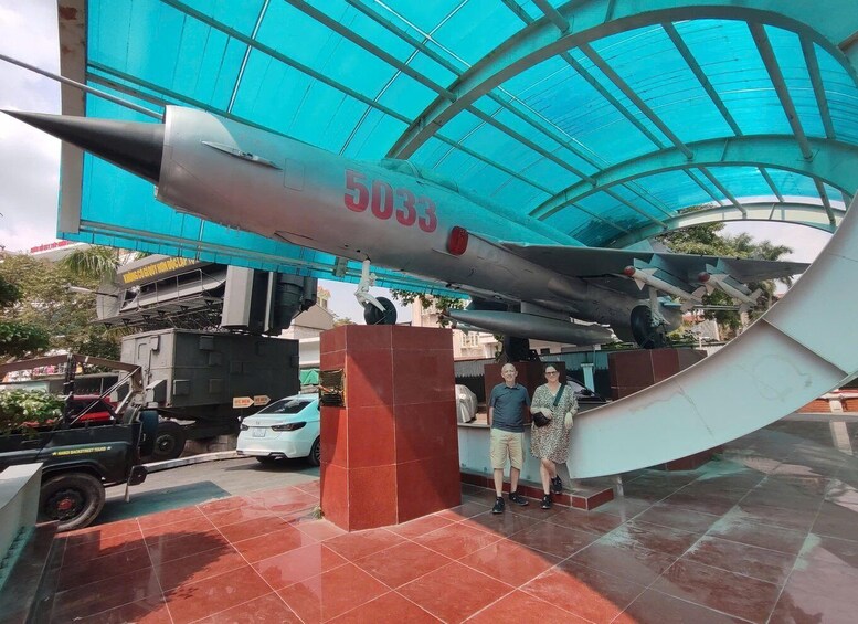 A large aircraft model with the number 5033 displayed on it, under a blue canopy structure. 1