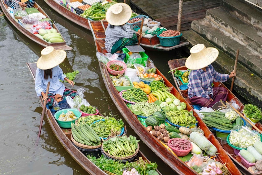 Canoes loaded with fresh produce on a river. 1