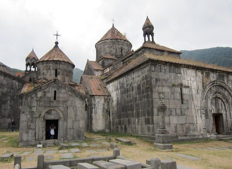 A historic church with multiple domes and a bell tower. 3